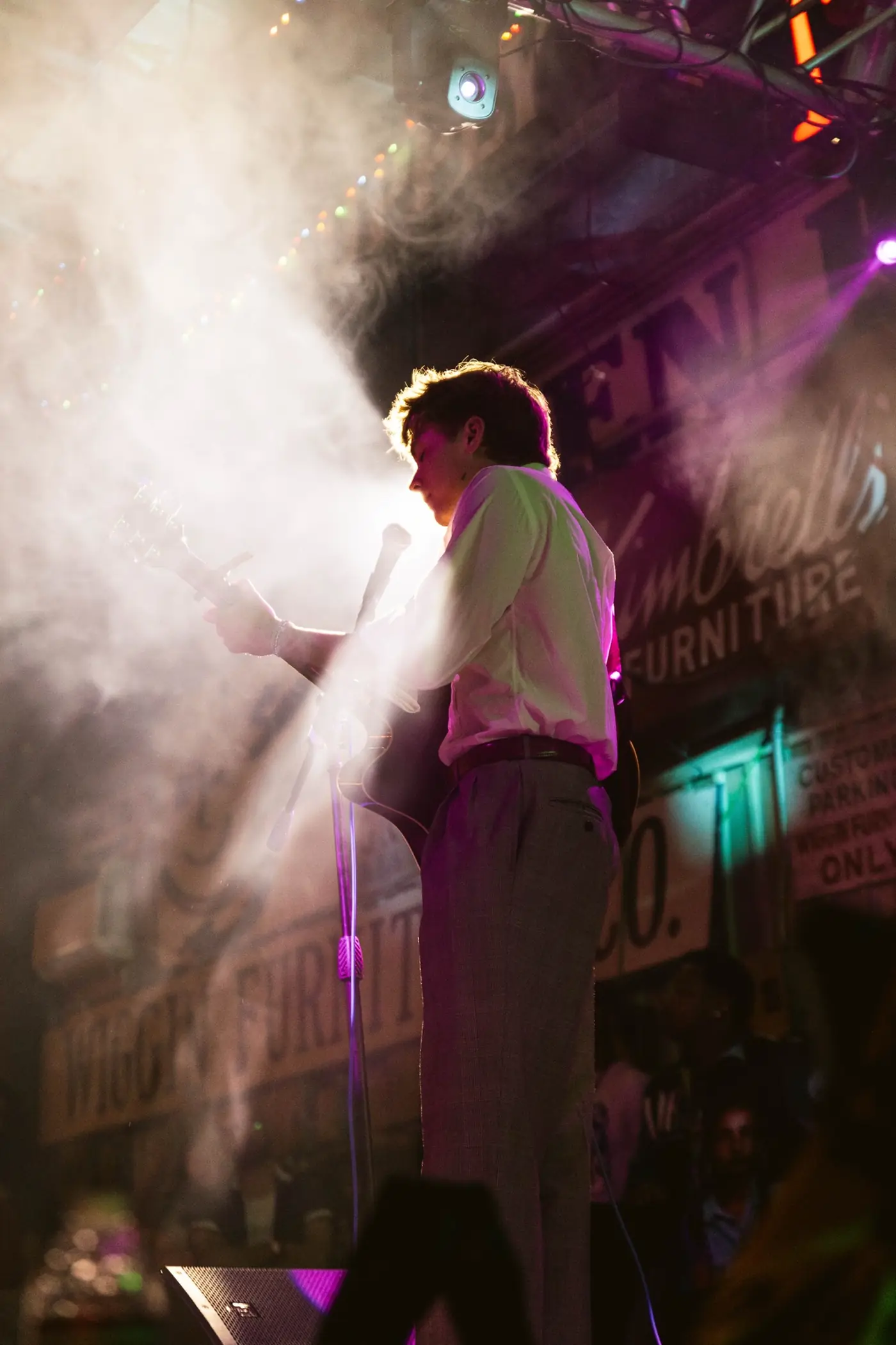 Cameron in stage fog, lit from behind